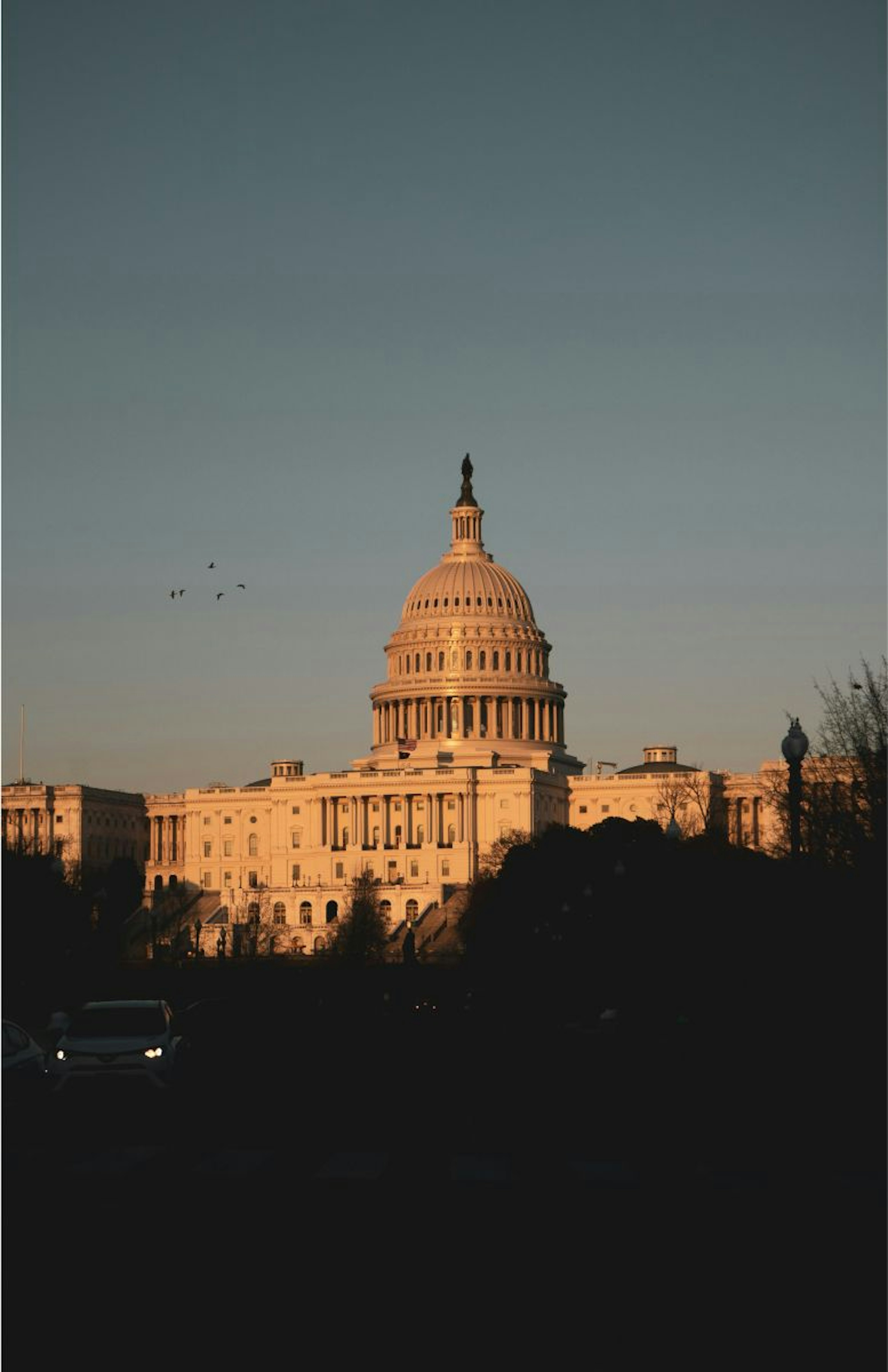 Photo of the US Capitol with a clear sky